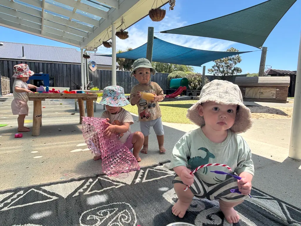 Toddlers enjoying outdoor play at one of our centres